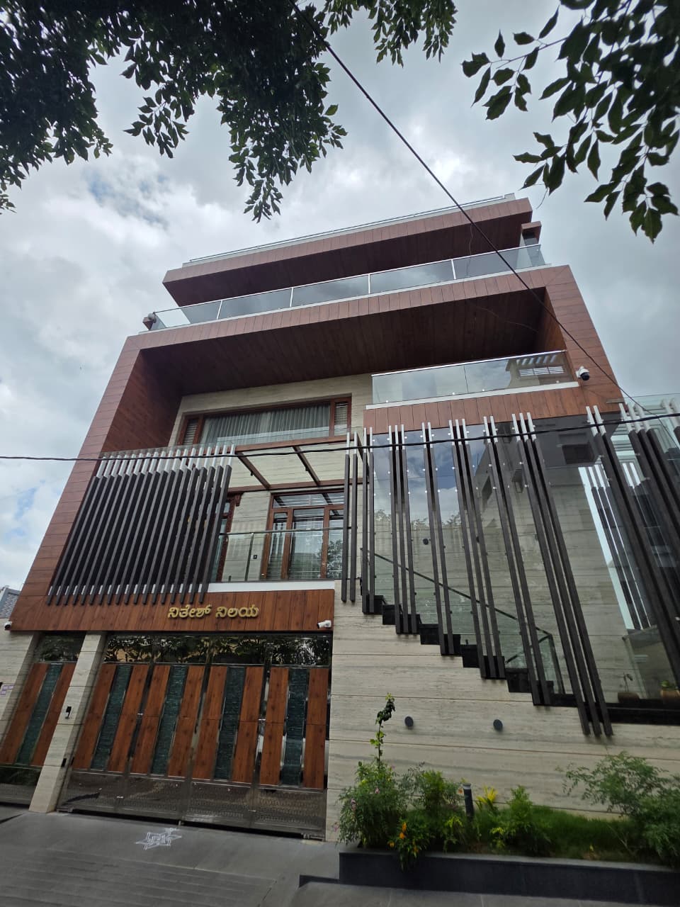 Nithesh Nilaya in Bengaluru with cladding, glazing and vertical fins
